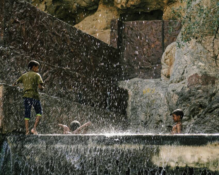 Kids playing in the hot springs on the Nizwa oasis in Western Hajar Mountains, Nizwa, Sultanate of Oman. Picture: Unsplash