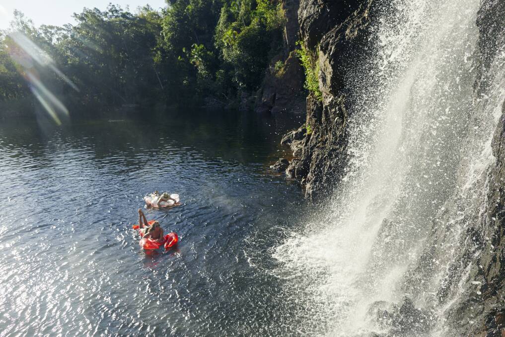 Friends Chilling at Wangi Falls. Picture: Tourism NT/Matt Cherubino