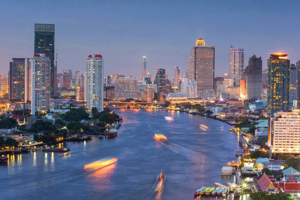 Bright lights and boats on the Chao Phraya.