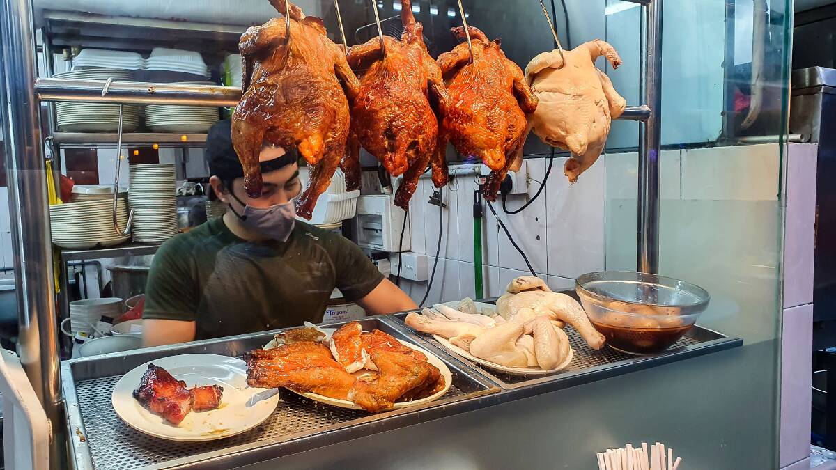 Roast duck and Hainanese chicken for sale in a food court. Picture: Shutterstock