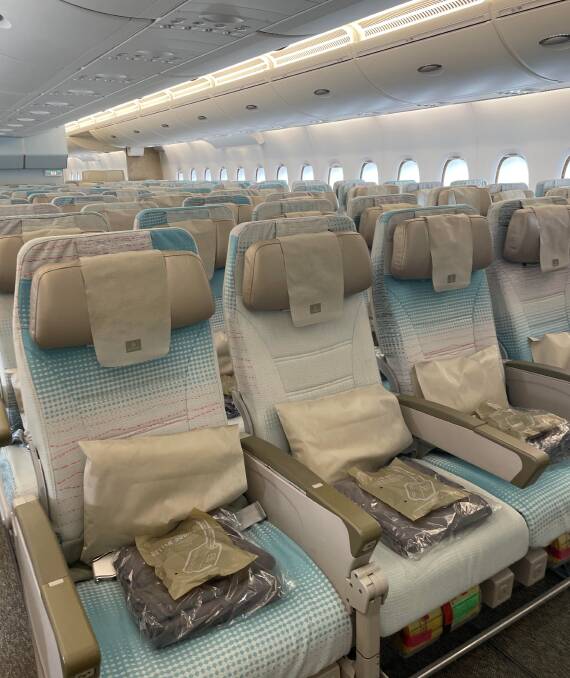 Compare the differences in seating options on an Emirates A-380 from economy to first class. 