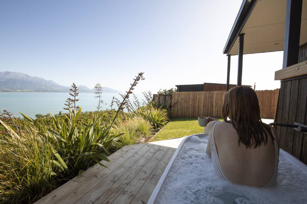 Outdoor bath time at the Clifftop Cabins in Kaikoura. Picture: Supplied