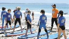 BEACH LESSON: Learn to Surf Newcastle SurfGroms hit the beach.