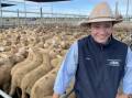 Kevin Miller, Whitty, Lennon and Company agent Jack Whitty, Forbes, with lambs that made $209 a head and were sold by Murphy Partnership, Cumnock, at the Forbes lamb sale on Tuesday. Picture by Karen Bailey.